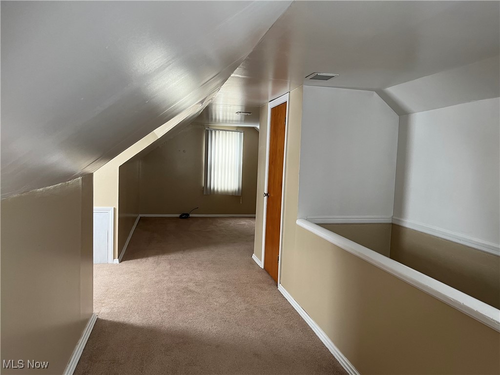 15405 Corkhill Road Maple Heights, OH 44137 - Photo 33 of 50 Dormer Bedroom Upstairs with light carpet and vaulted ceiling