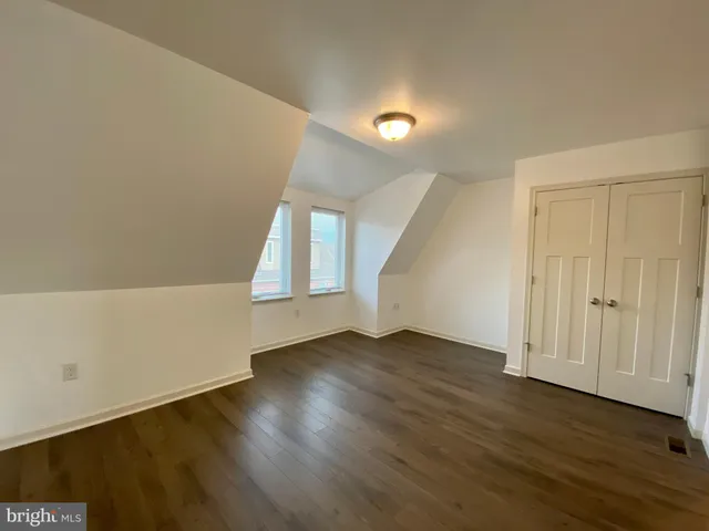 a bathroom with a sink toilet a mirror and bathtub