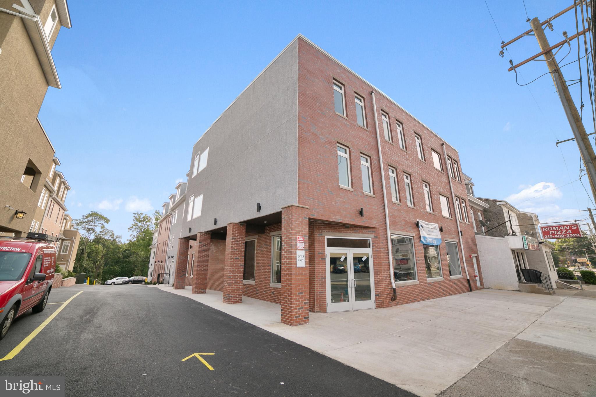 6615 Ridge Avenue, Unit 105 Philadelphia, PA 19128 - Photo 14 of 14 a view of a building with a street