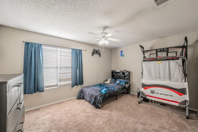 a bedroom with furniture and windows