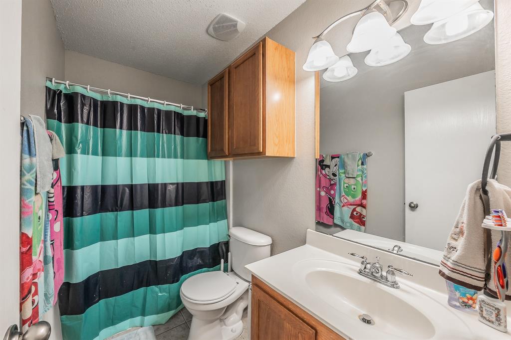 146 Independence Avenue Venus, TX 76084 - Photo 18 of 21 a bathroom with a sink toilet and shower