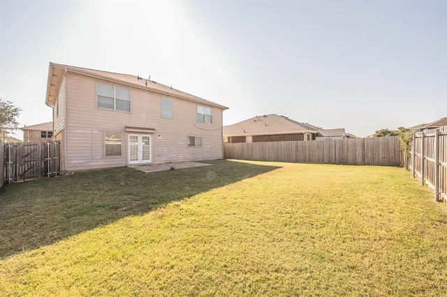 a house view with swimming pool in front of it