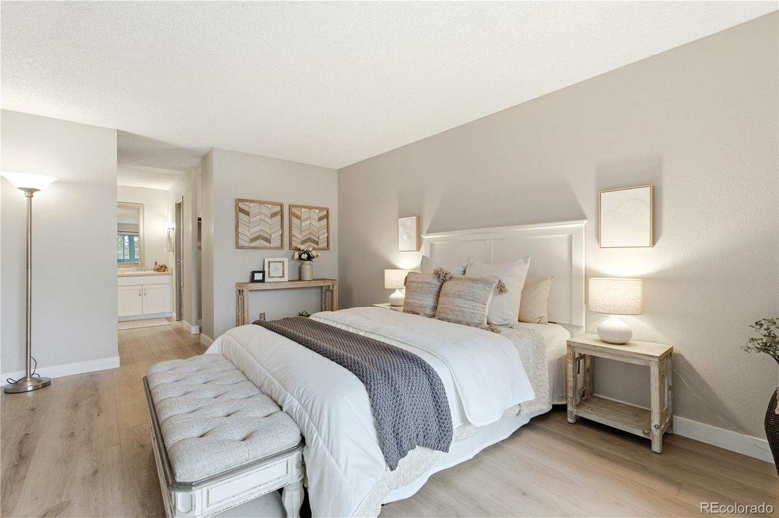 2880 South Locust Street, Unit 200S Denver, CO 80222 - Photo 14 of 43 a bedroom with a bed and a table