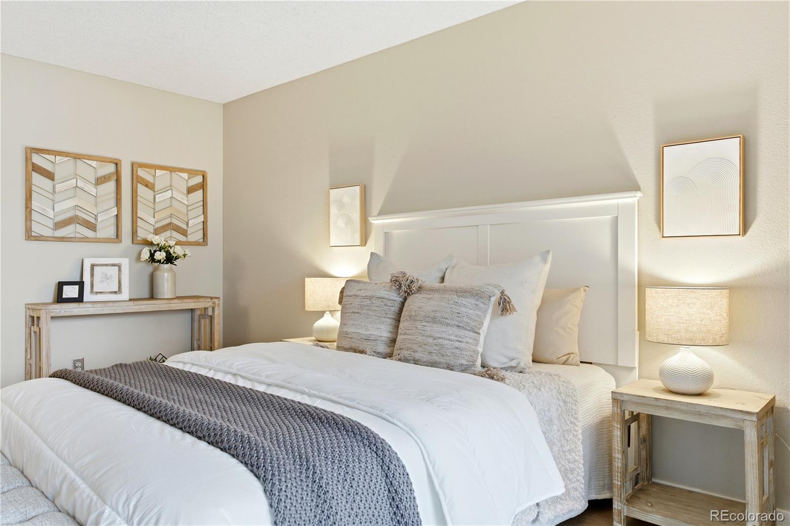 2880 South Locust Street, Unit 200S Denver, CO 80222 - Photo 16 of 43 a bedroom with a bed and lamp