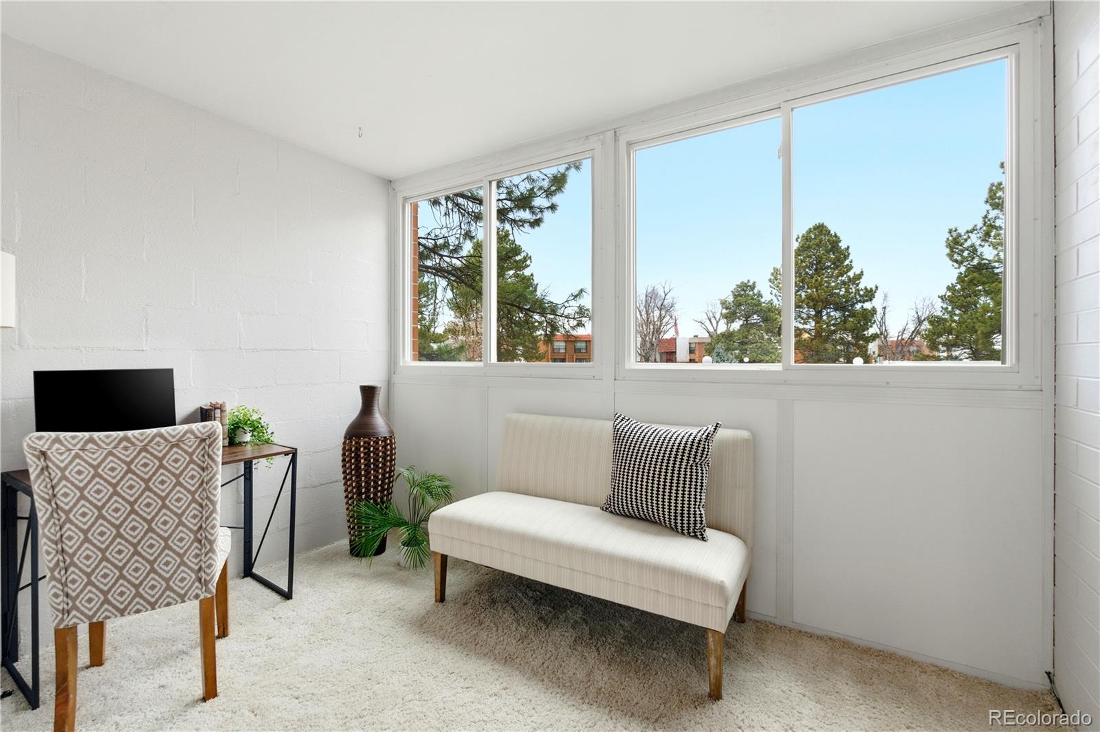 2880 South Locust Street, Unit 200S Denver, CO 80222 - Photo 21 of 43 a living room with furniture and a window