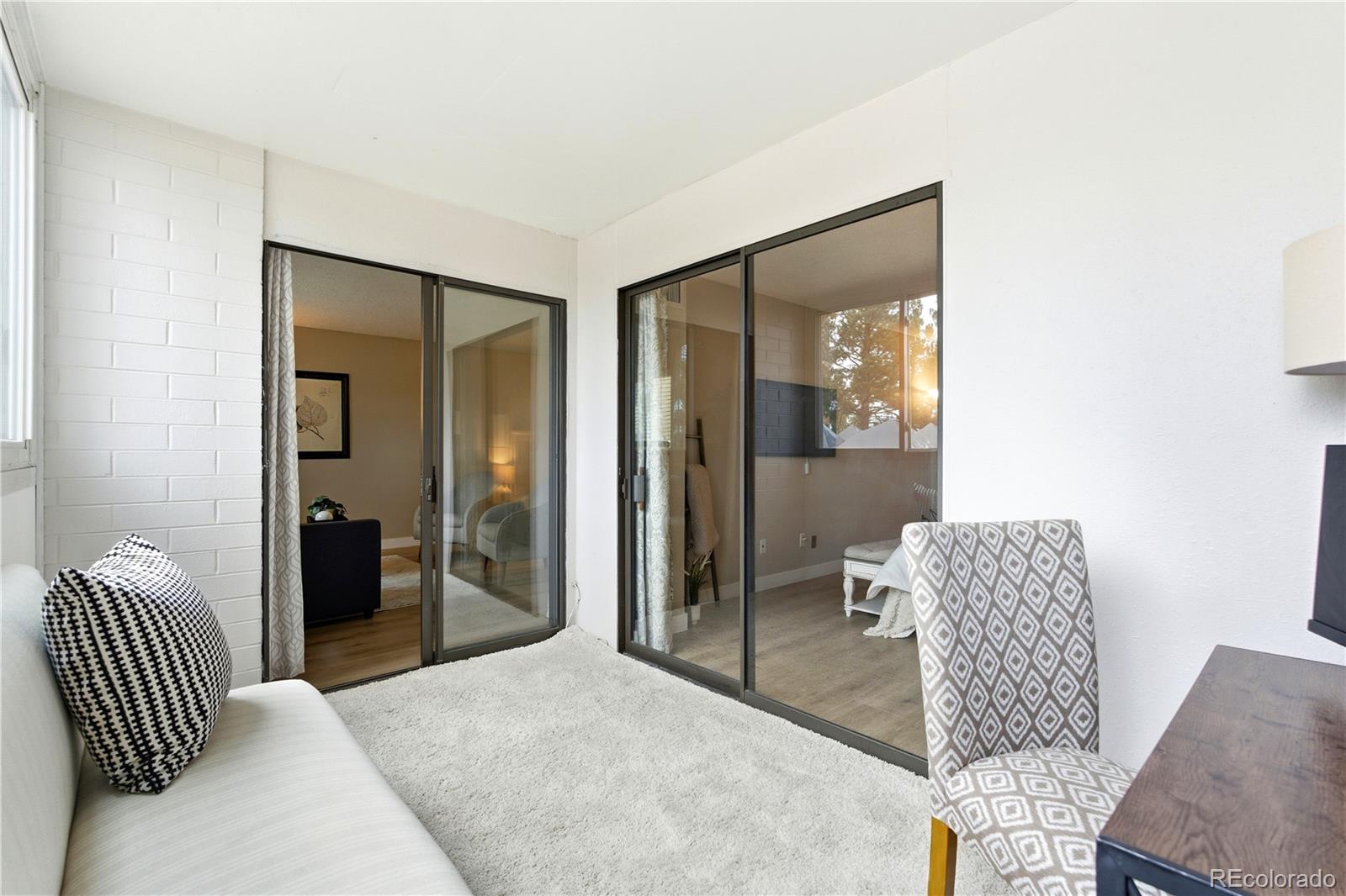 2880 South Locust Street, Unit 200S Denver, CO 80222 - Photo 23 of 43 a living room with furniture and a window