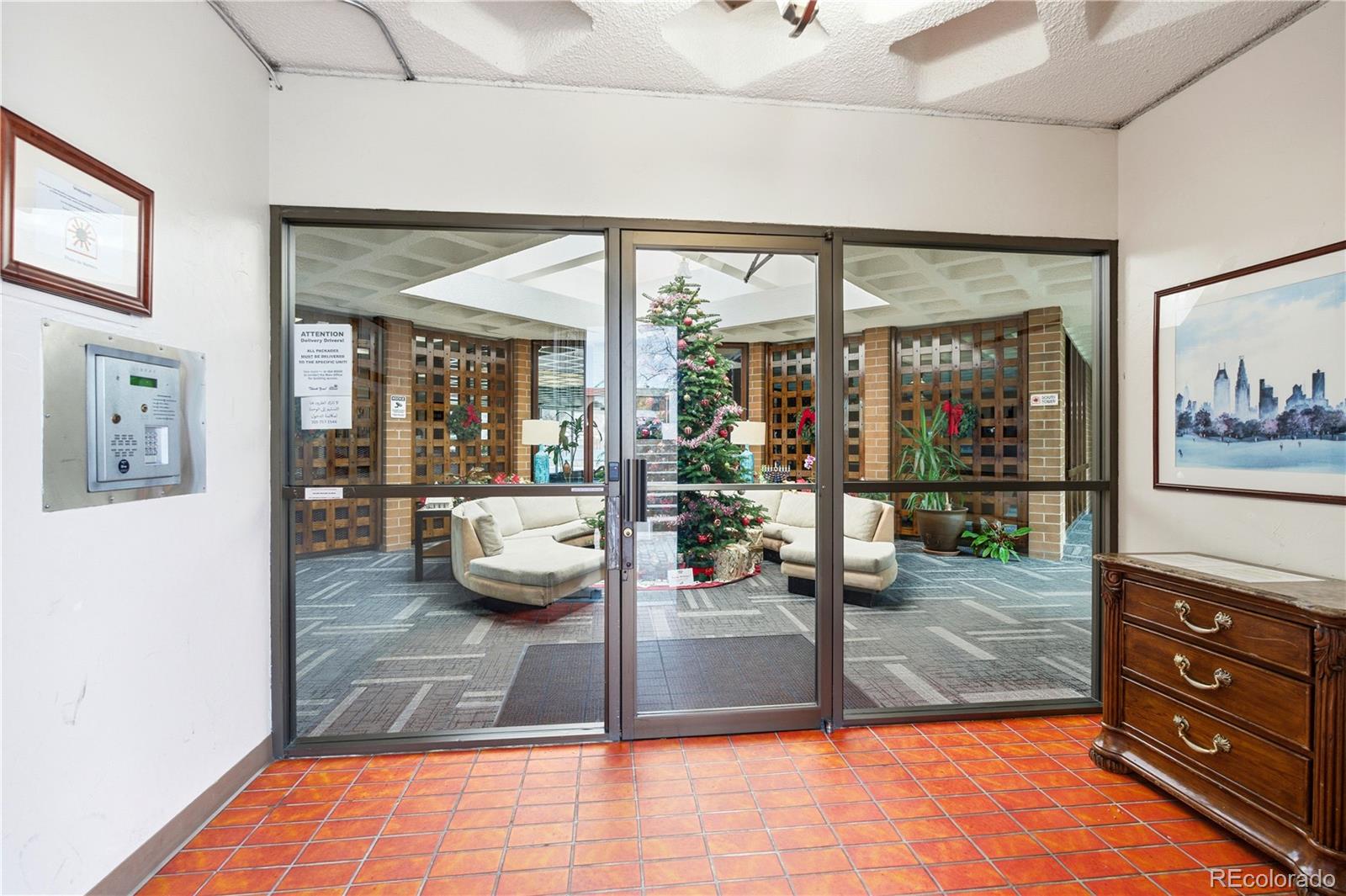 2880 South Locust Street, Unit 200S Denver, CO 80222 - Photo 26 of 43 a living room with hardwood floor and large window
