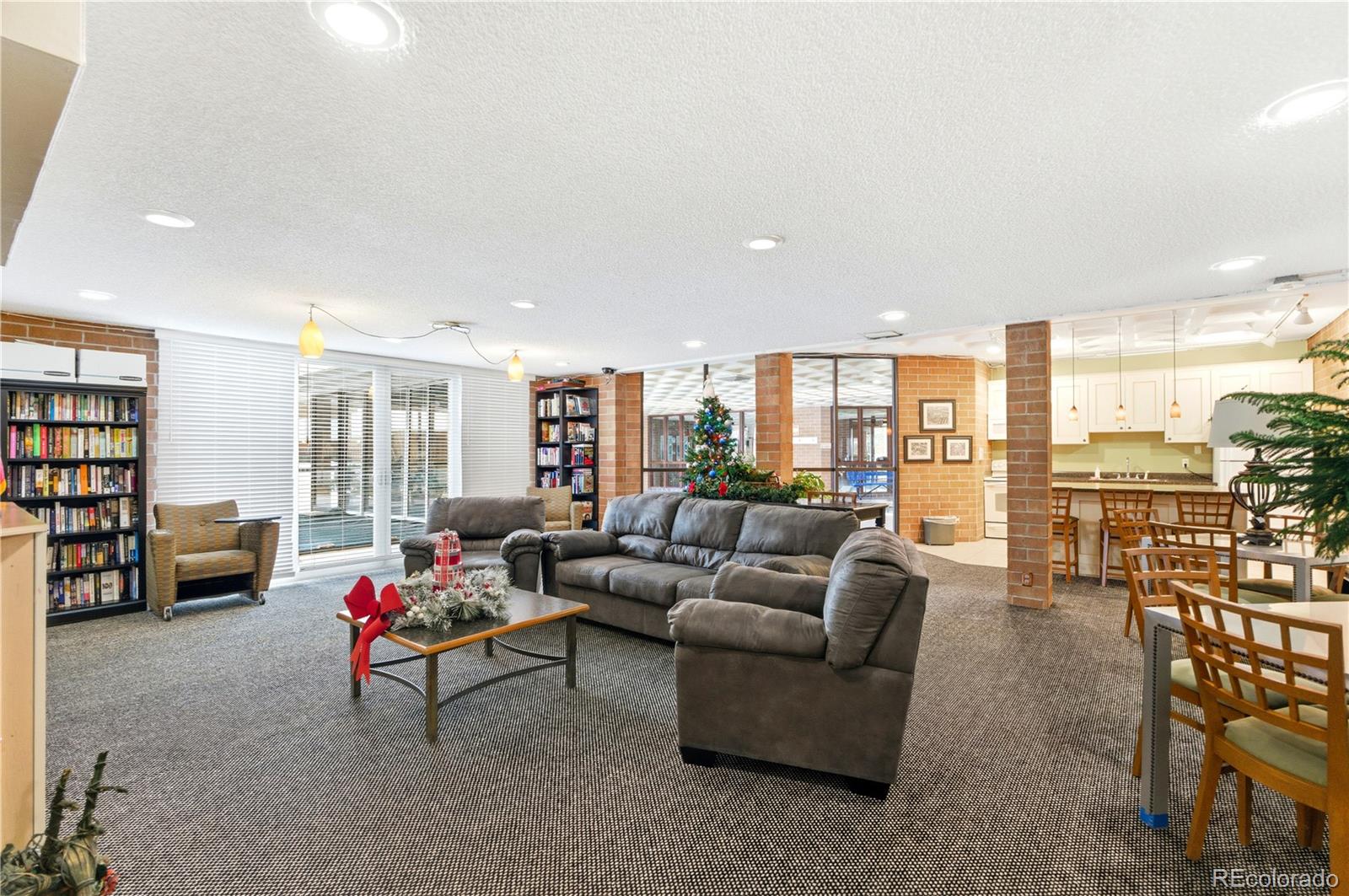 2880 South Locust Street, Unit 200S Denver, CO 80222 - Photo 30 of 43 a living room with furniture and a large window