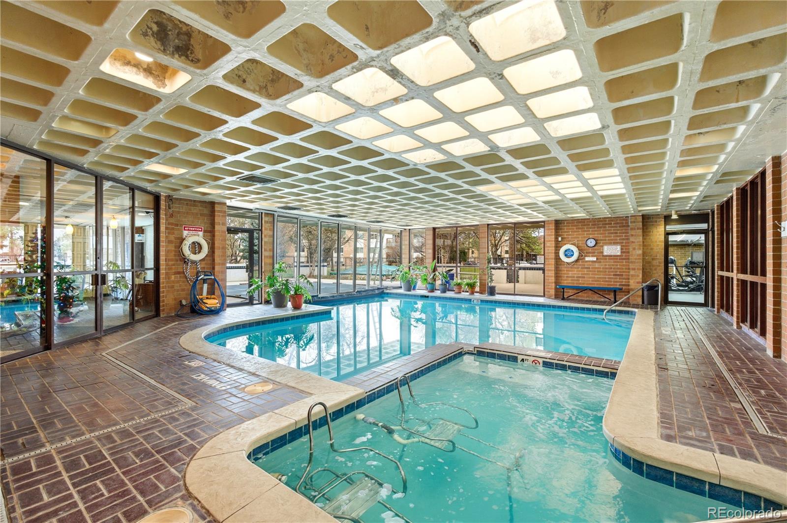 2880 South Locust Street, Unit 200S Denver, CO 80222 - Photo 34 of 43 a view of a patio with a table and chairs
