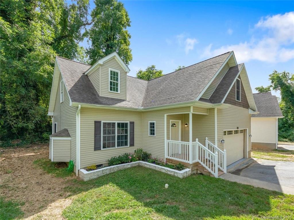 80 Sand Hill Road Asheville, NC 28806 - Photo 1 of 28 a front view of a house with a yard