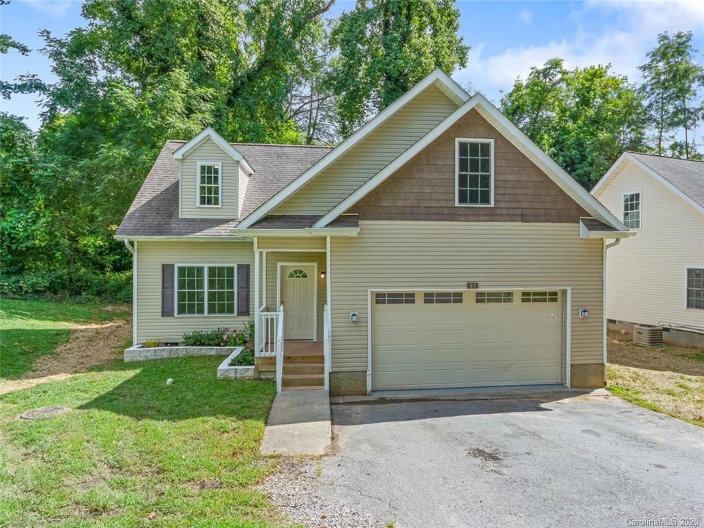 80 Sand Hill Road Asheville, NC 28806 - Photo 2 of 28 a front view of a house with a yard and garage