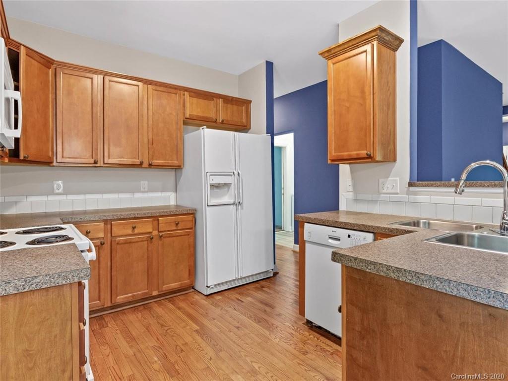 80 Sand Hill Road Asheville, NC 28806 - Photo 11 of 28 a kitchen with granite countertop a sink stove and refrigerator