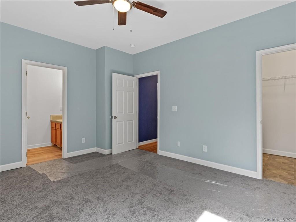 80 Sand Hill Road Asheville, NC 28806 - Photo 17 of 28 an empty room with ceiling fan and window