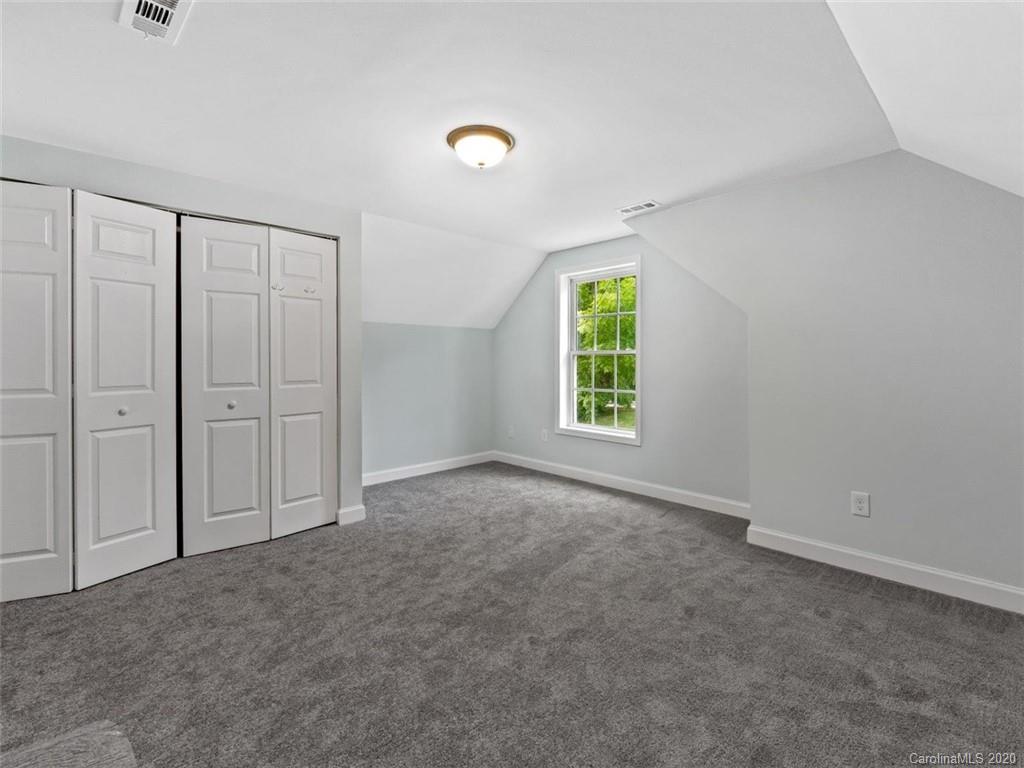 80 Sand Hill Road Asheville, NC 28806 - Photo 20 of 28 an empty room with windows and closet