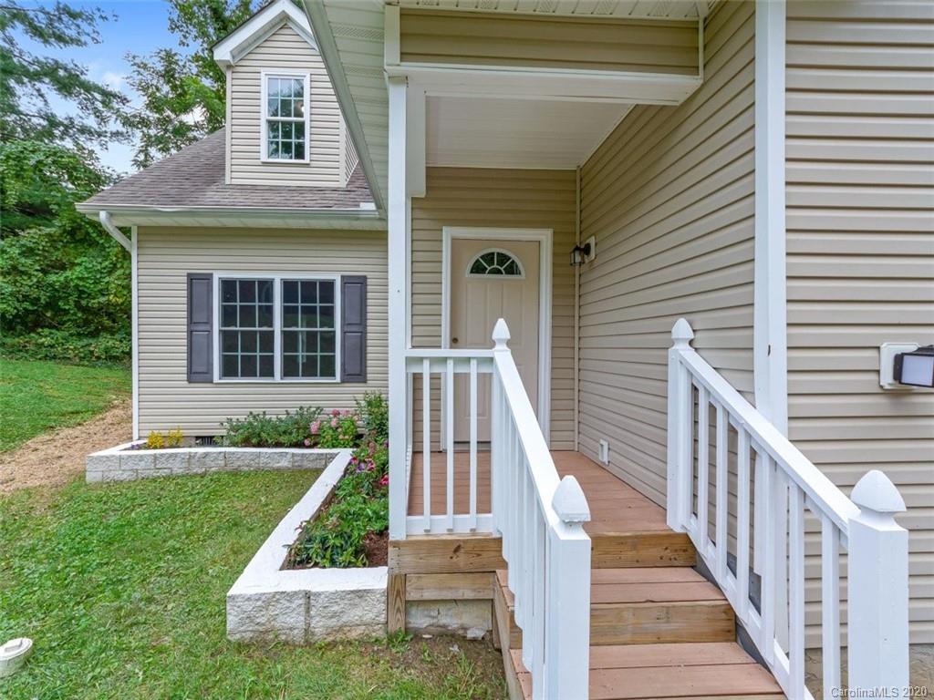 80 Sand Hill Road Asheville, NC 28806 - Photo 3 of 28 a view of house with backyard porch and furniture