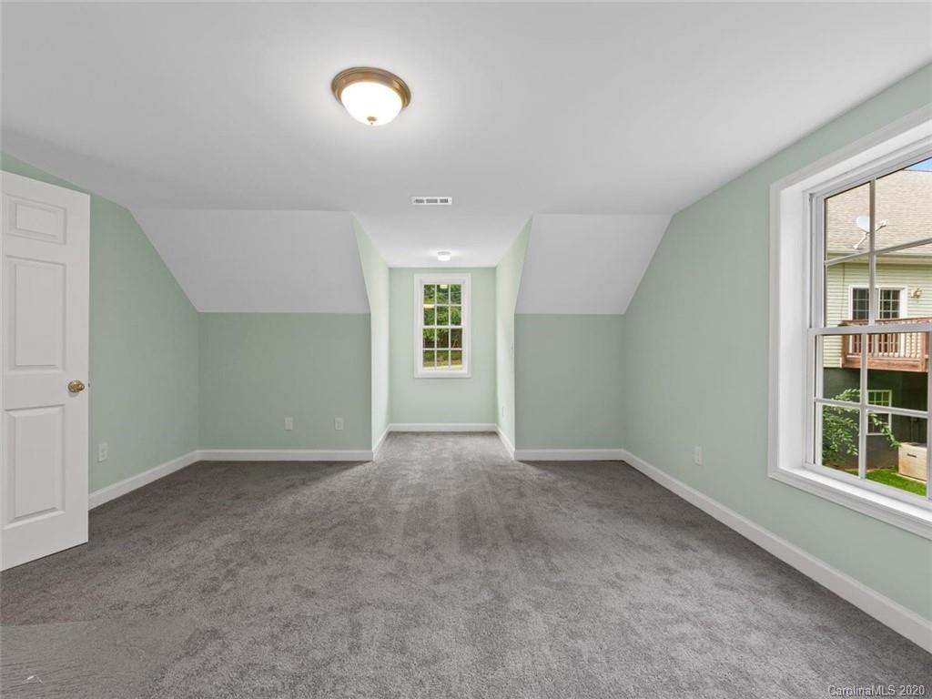80 Sand Hill Road Asheville, NC 28806 - Photo 23 of 28 an empty room with windows and closet