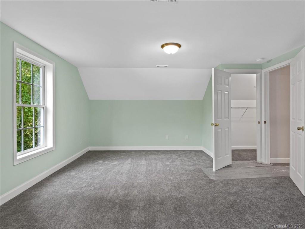 80 Sand Hill Road Asheville, NC 28806 - Photo 24 of 28 an empty room with windows and closet