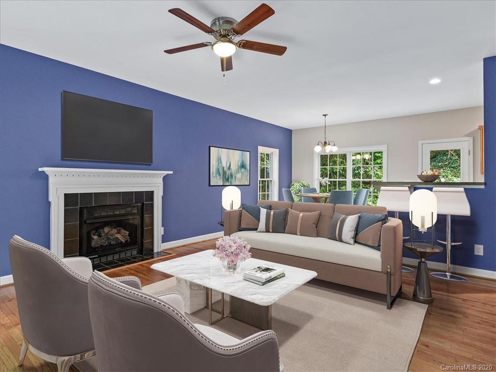 80 Sand Hill Road Asheville, NC 28806 - Photo 5 of 28 a living room with furniture a fireplace and a flat screen tv