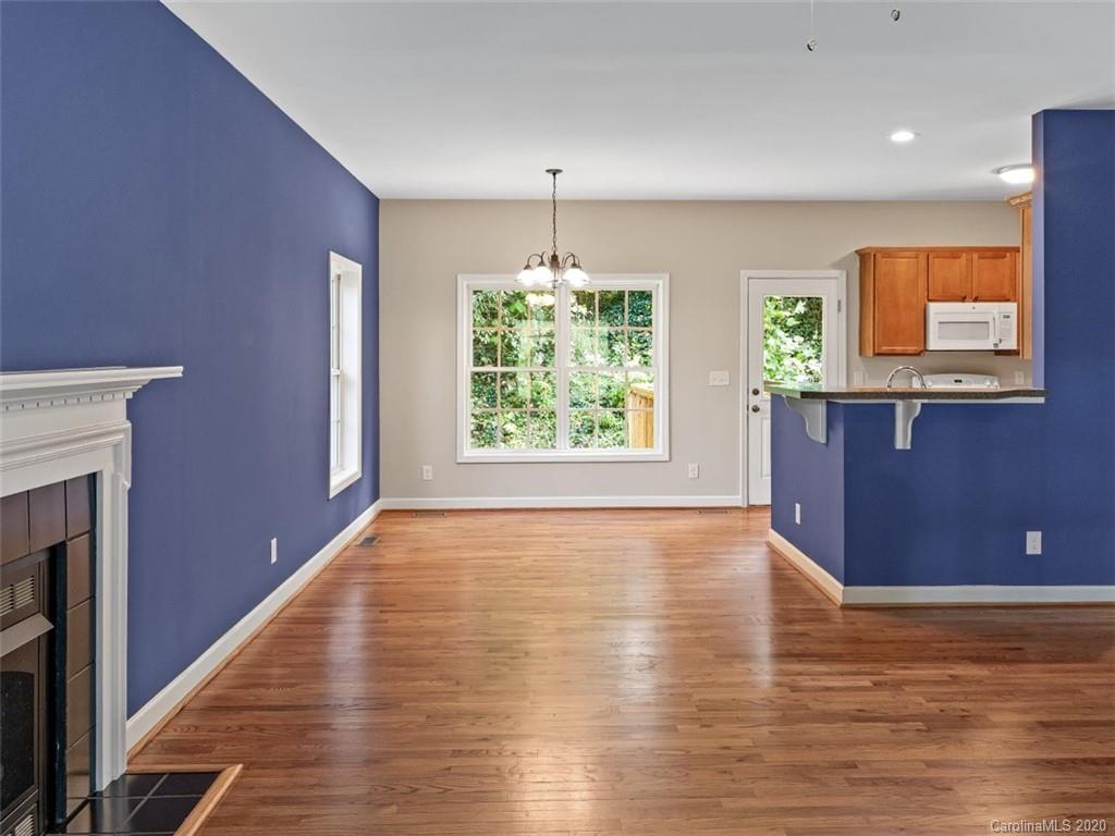 80 Sand Hill Road Asheville, NC 28806 - Photo 8 of 28 a view of an empty room with window and wooden floor