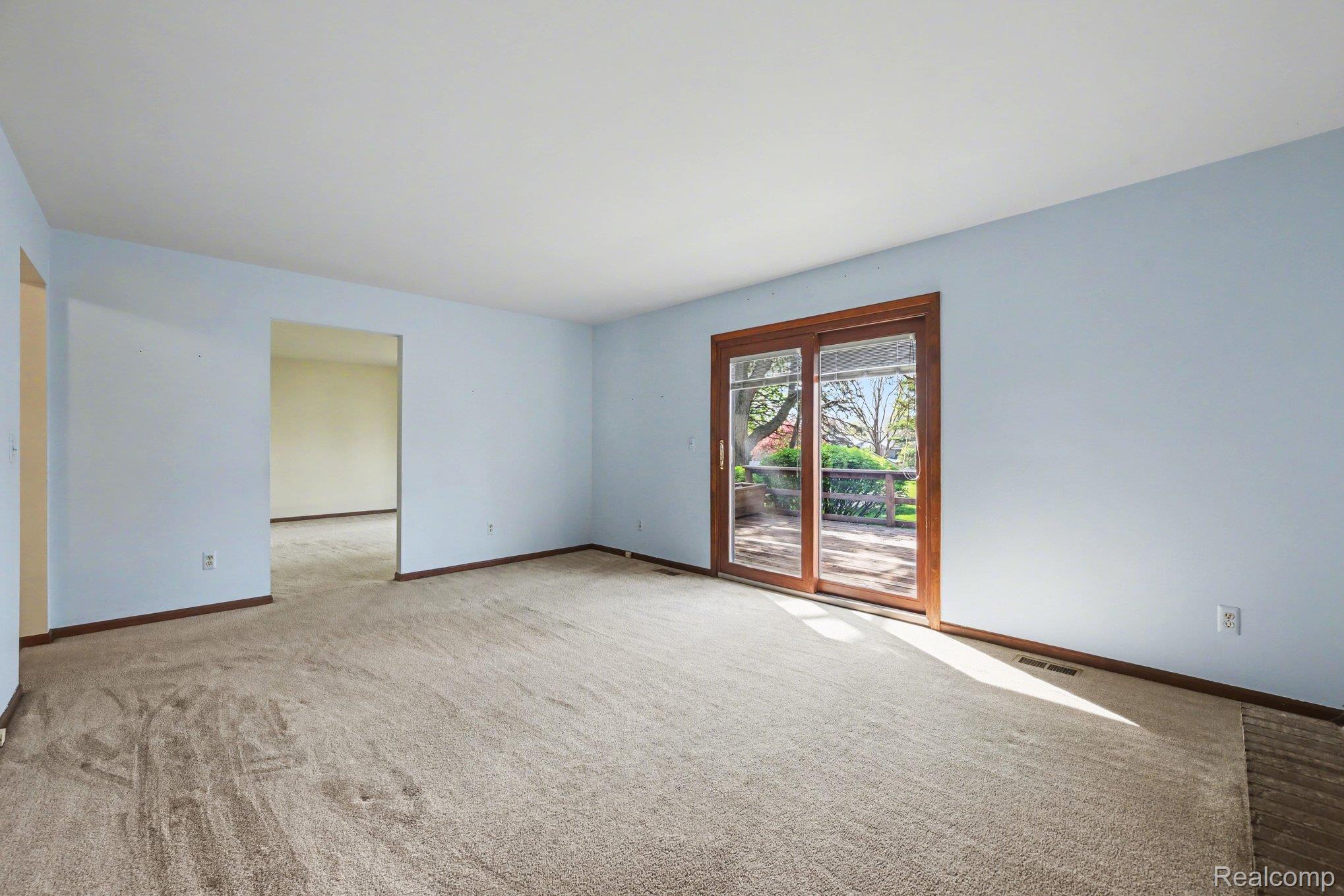 33593 Curtis Road Livonia, MI 48152 - Photo 7 of 30 Spare room featuring light colored carpet and baseboards