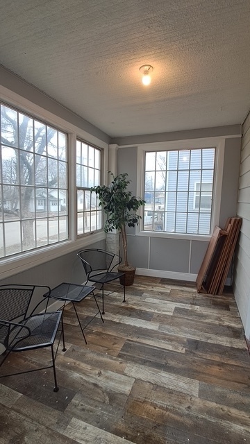 212 West Division Street Bloomington, IL 61701 - Photo 4 of 12 a view of a livingroom with chairs and a window