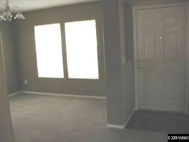 7679 Corso Street Reno, NV 89506 - Photo 2 of 7 a view of an empty room with a window