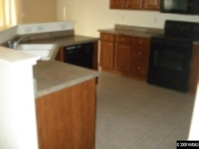 7679 Corso Street Reno, NV 89506 - Photo 7 of 7 a utility room with dryer and washer