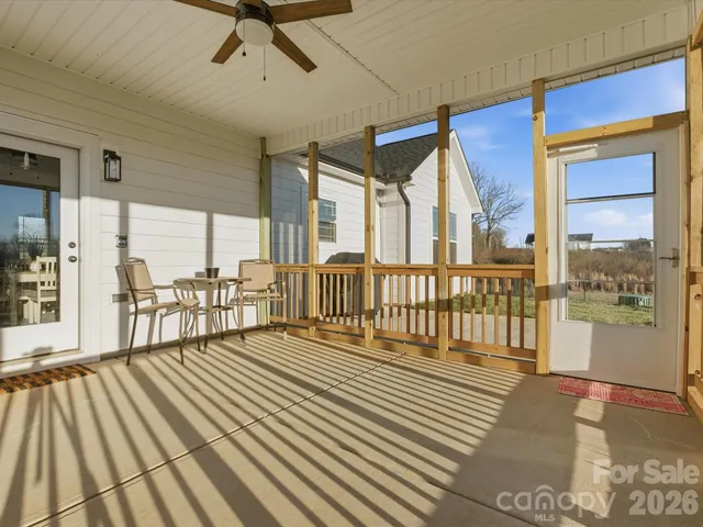 a view of a balcony with wooden floor