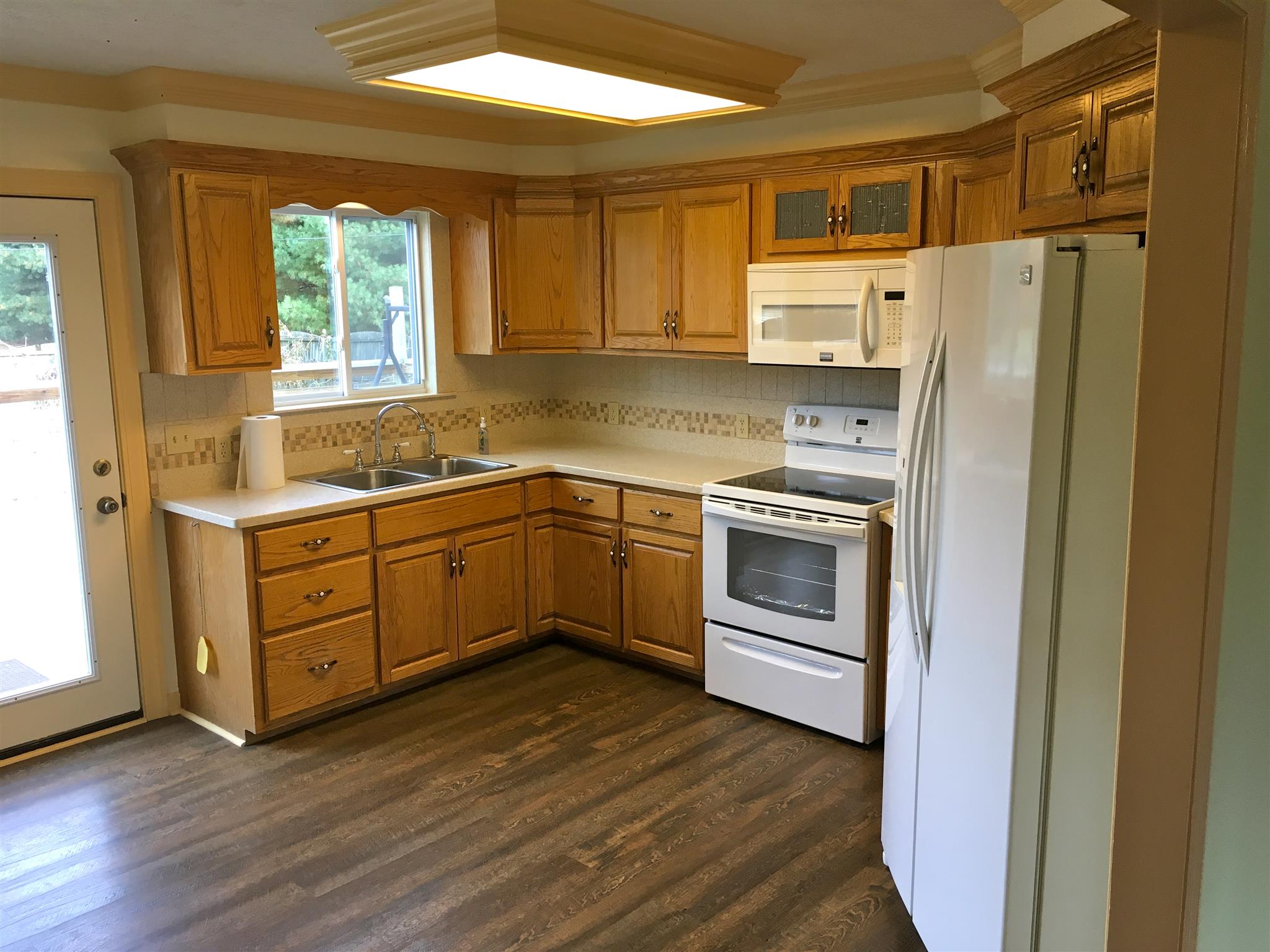 2735 New Hall Road Greenbrier, TN 37073 - Photo 9 of 26 a kitchen with a white cabinets and stainless steel appliances