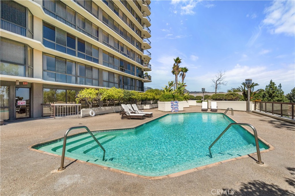 222 Monterey Road, Unit 901 Glendale, CA 91206 - Photo 64 of 68 a swimming pool with outdoor seating and yard