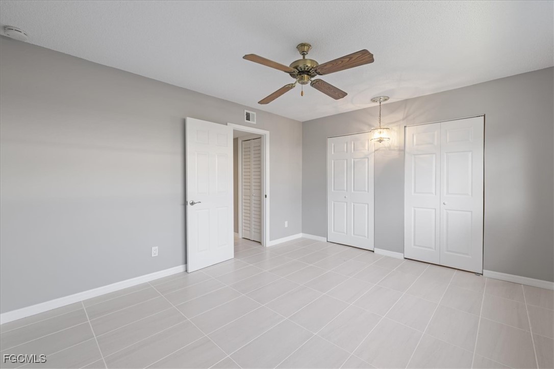 3225 East Riverside Drive, Unit 63F Fort Myers, FL 33905 - Photo 16 of 30 a view of an empty room and wooden floor