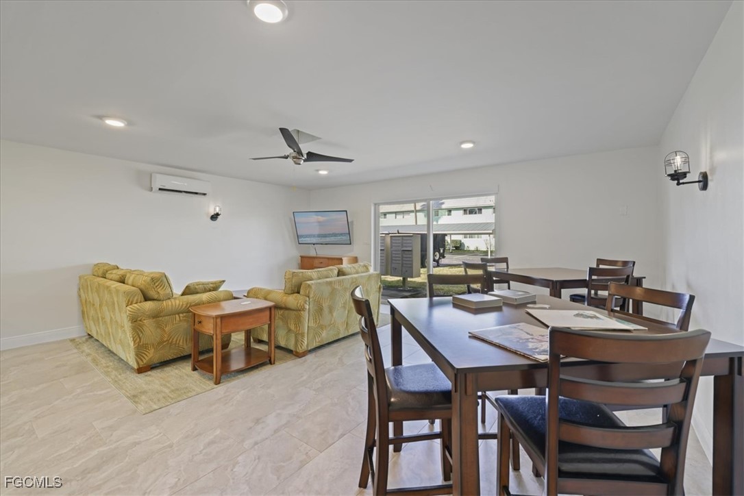 3225 East Riverside Drive, Unit 63F Fort Myers, FL 33905 - Photo 20 of 30 a view of a dining room with furniture