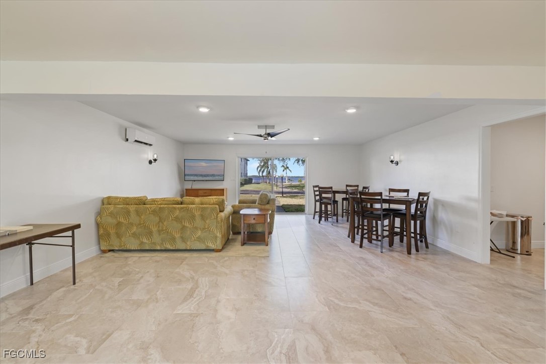 3225 East Riverside Drive, Unit 63F Fort Myers, FL 33905 - Photo 21 of 30 a living room with furniture and wooden floor