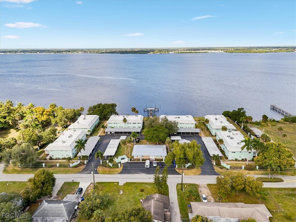 3225 East Riverside Drive, Unit 63F Fort Myers, FL 33905 - Photo 22 of 30 an aerial view of residential houses with outdoor space