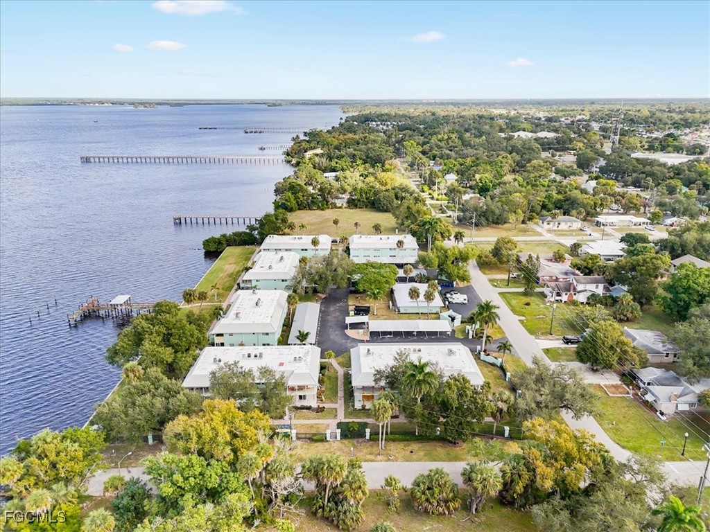 3225 East Riverside Drive, Unit 63F Fort Myers, FL 33905 - Photo 24 of 30 an aerial view of residential houses with outdoor space