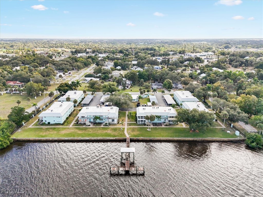 3225 East Riverside Drive, Unit 63F Fort Myers, FL 33905 - Photo 25 of 30 an aerial view of residential houses with outdoor space