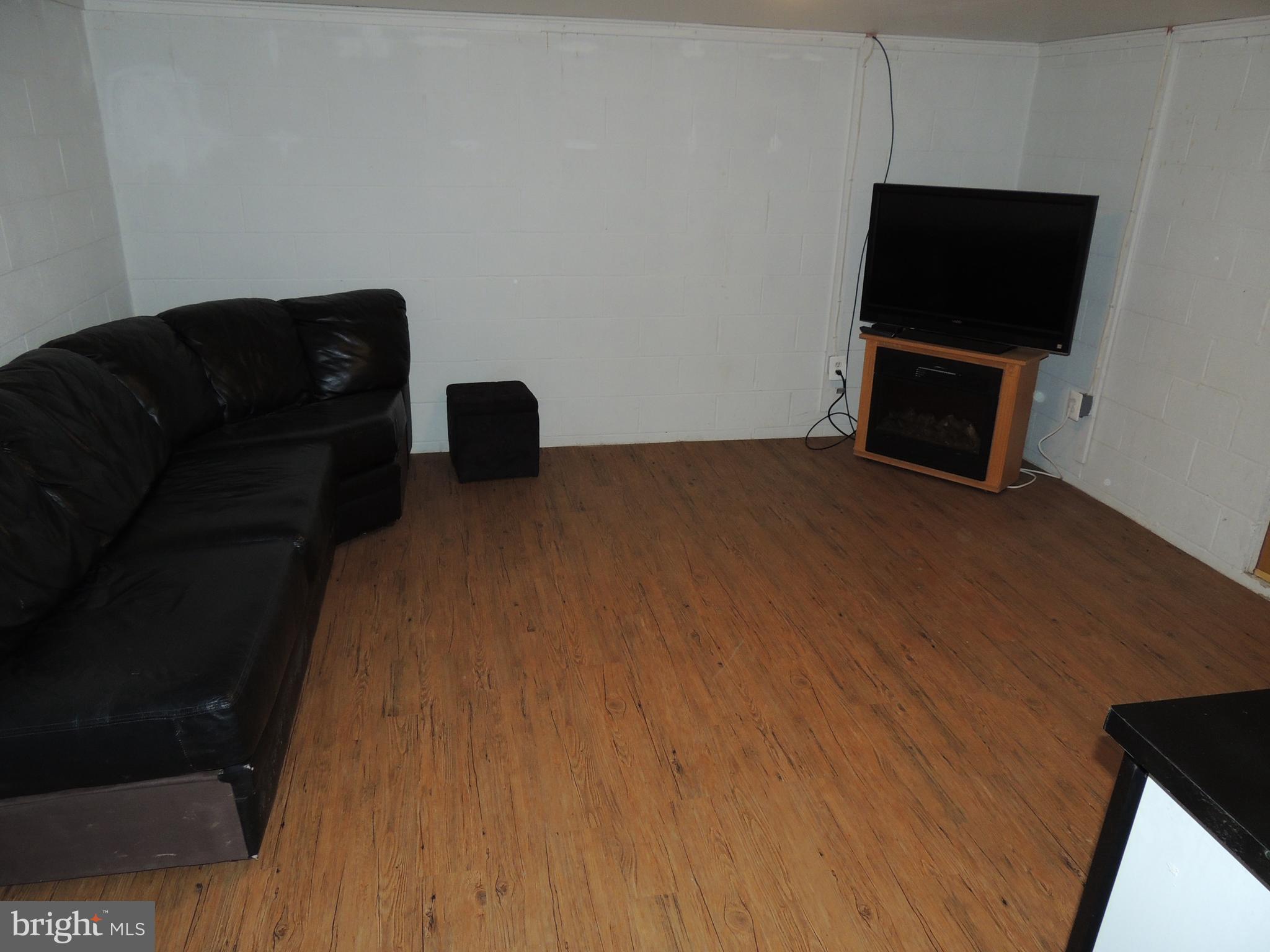 4142 Black Rock Road Hampstead, MD 21074 - Photo 42 of 61 Lower level TV room with door to rear patio