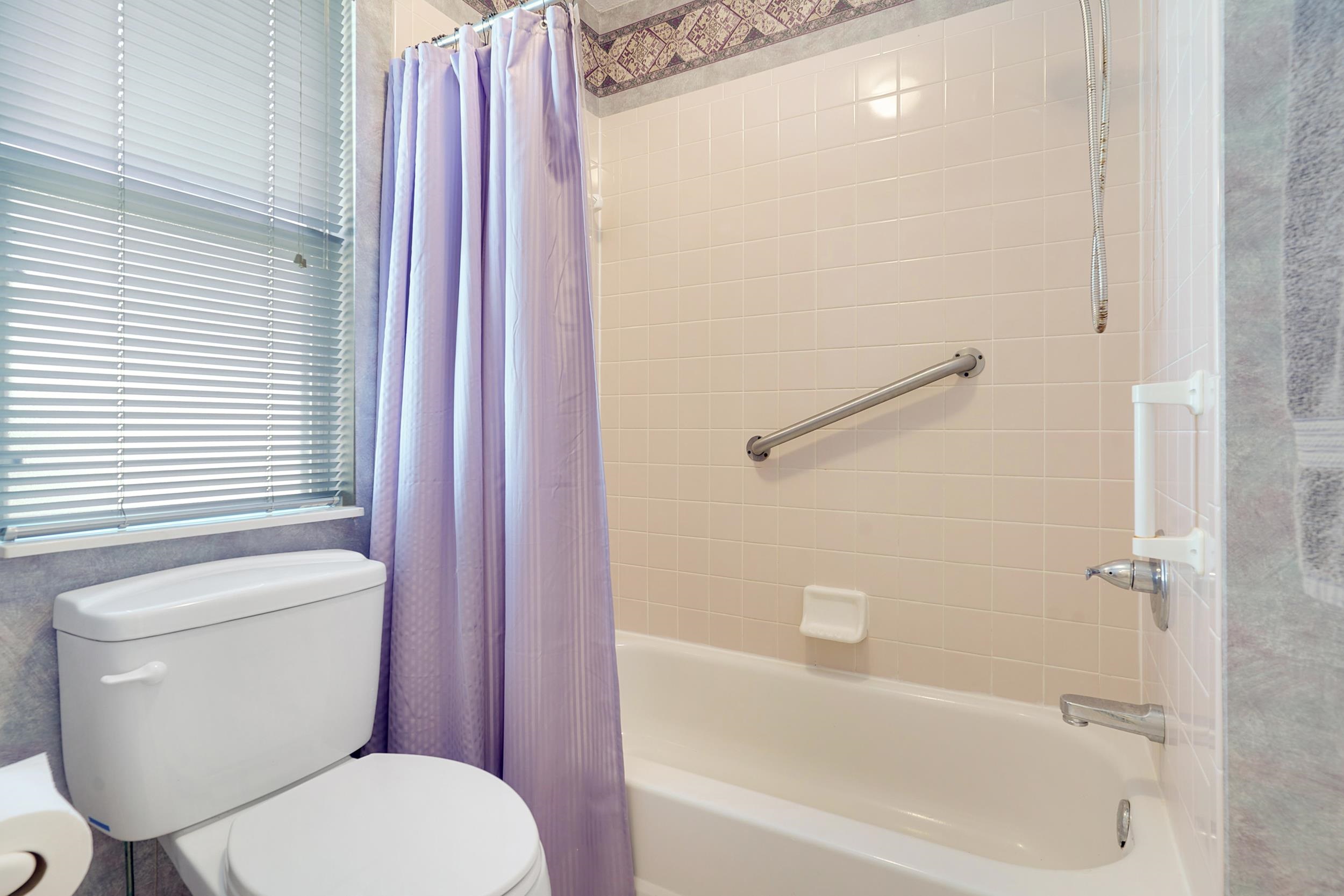 101 Marsh Place North St. Augustine, FL 32080 - Photo 14 of 42 a white toilet sitting next to a bath tub