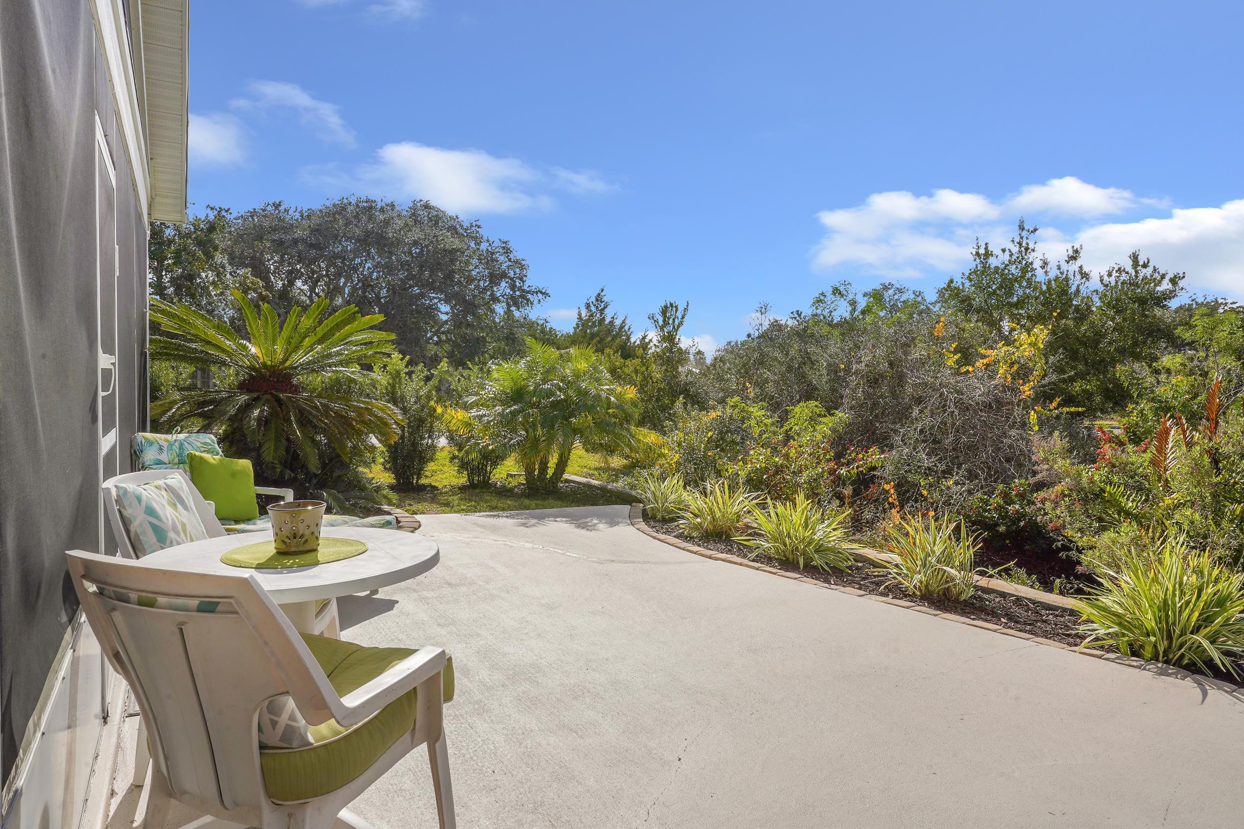 101 Marsh Place North St. Augustine, FL 32080 - Photo 33 of 42 a backyard of a house with table and chairs