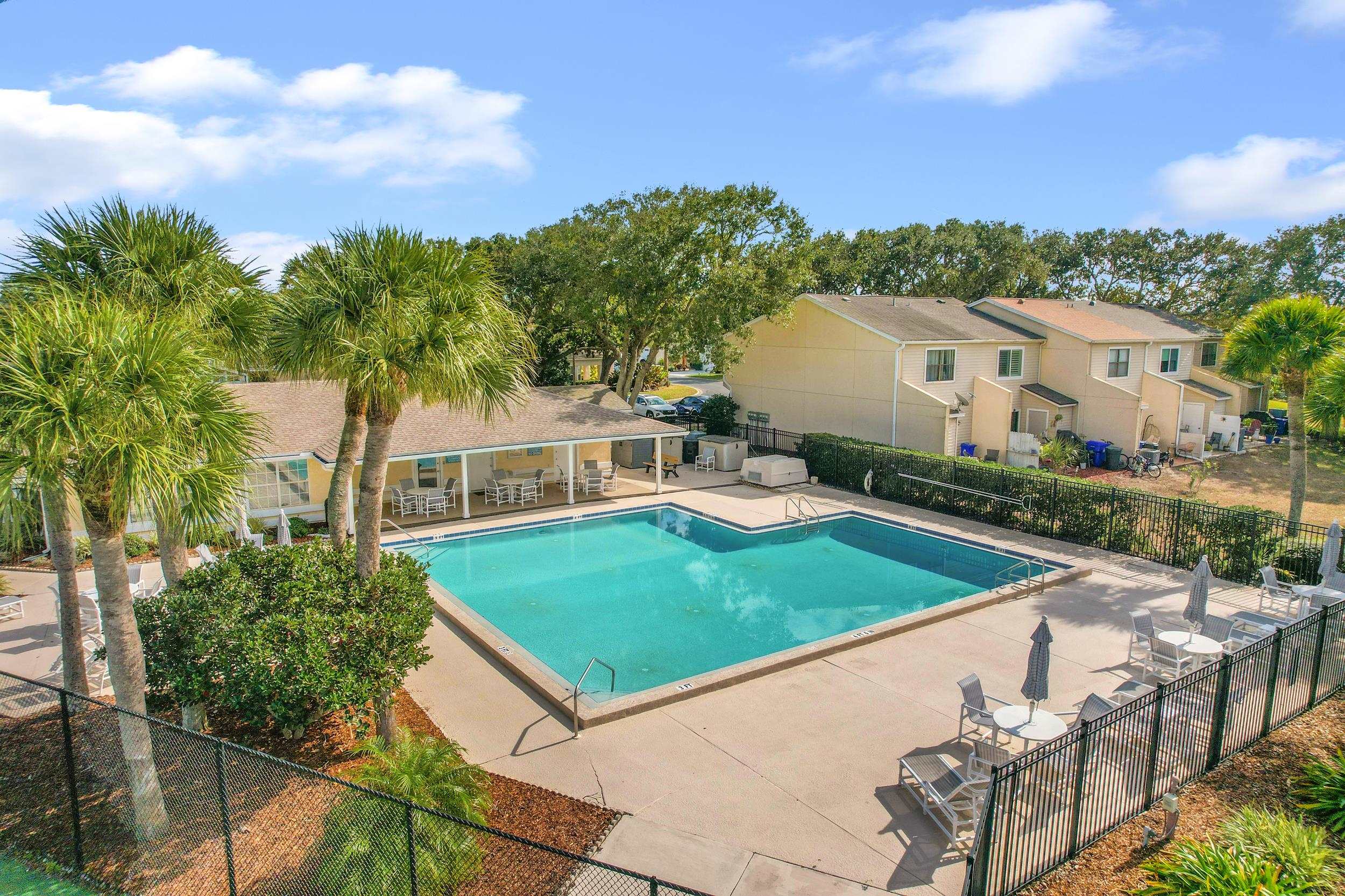 101 Marsh Place North St. Augustine, FL 32080 - Photo 42 of 42 a view of a white house with a yard and potted plants