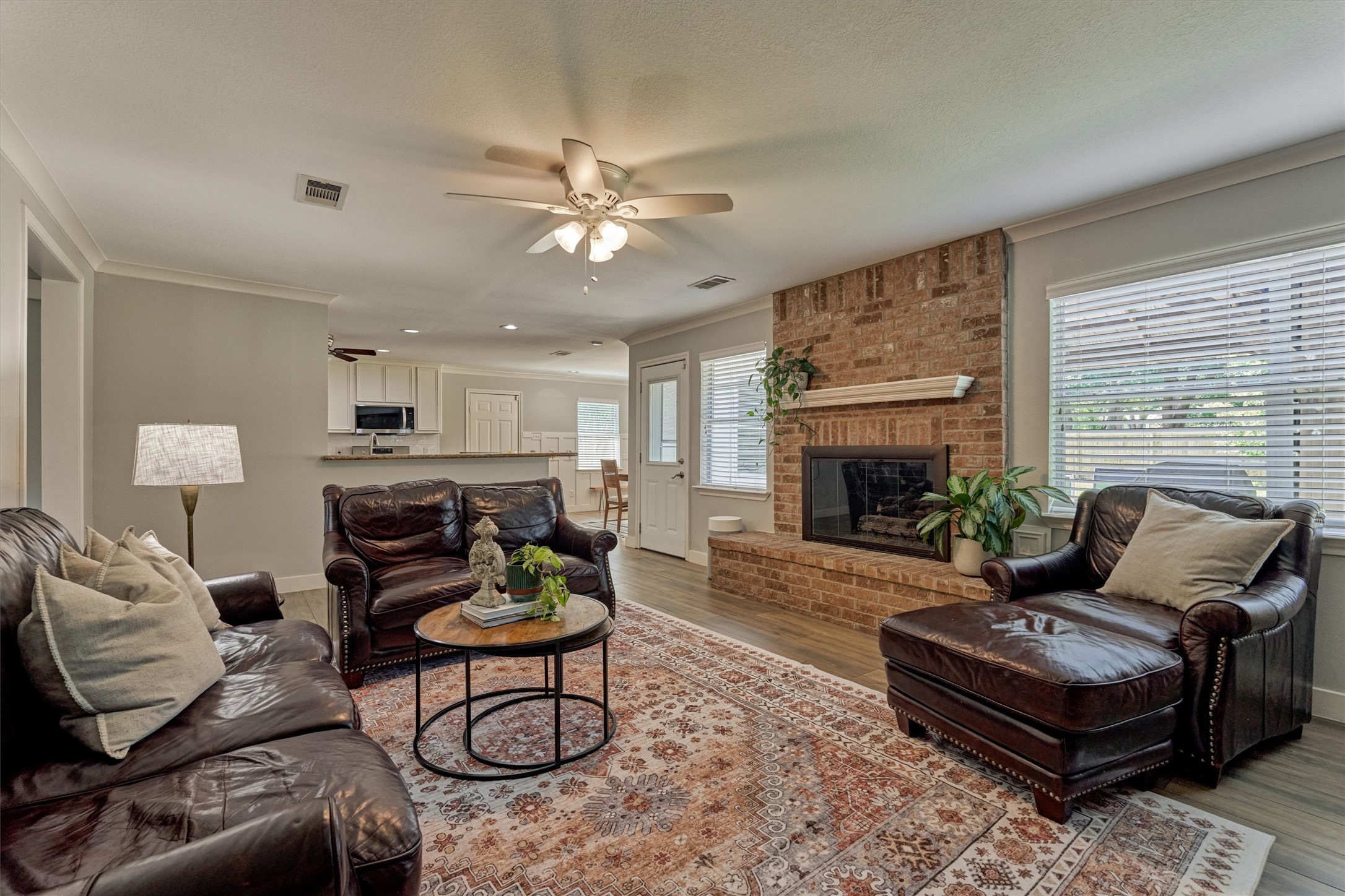 6515 Glenhill Drive Spring, TX 77389 - Photo 16 of 39 a living room with furniture a fireplace and a large window