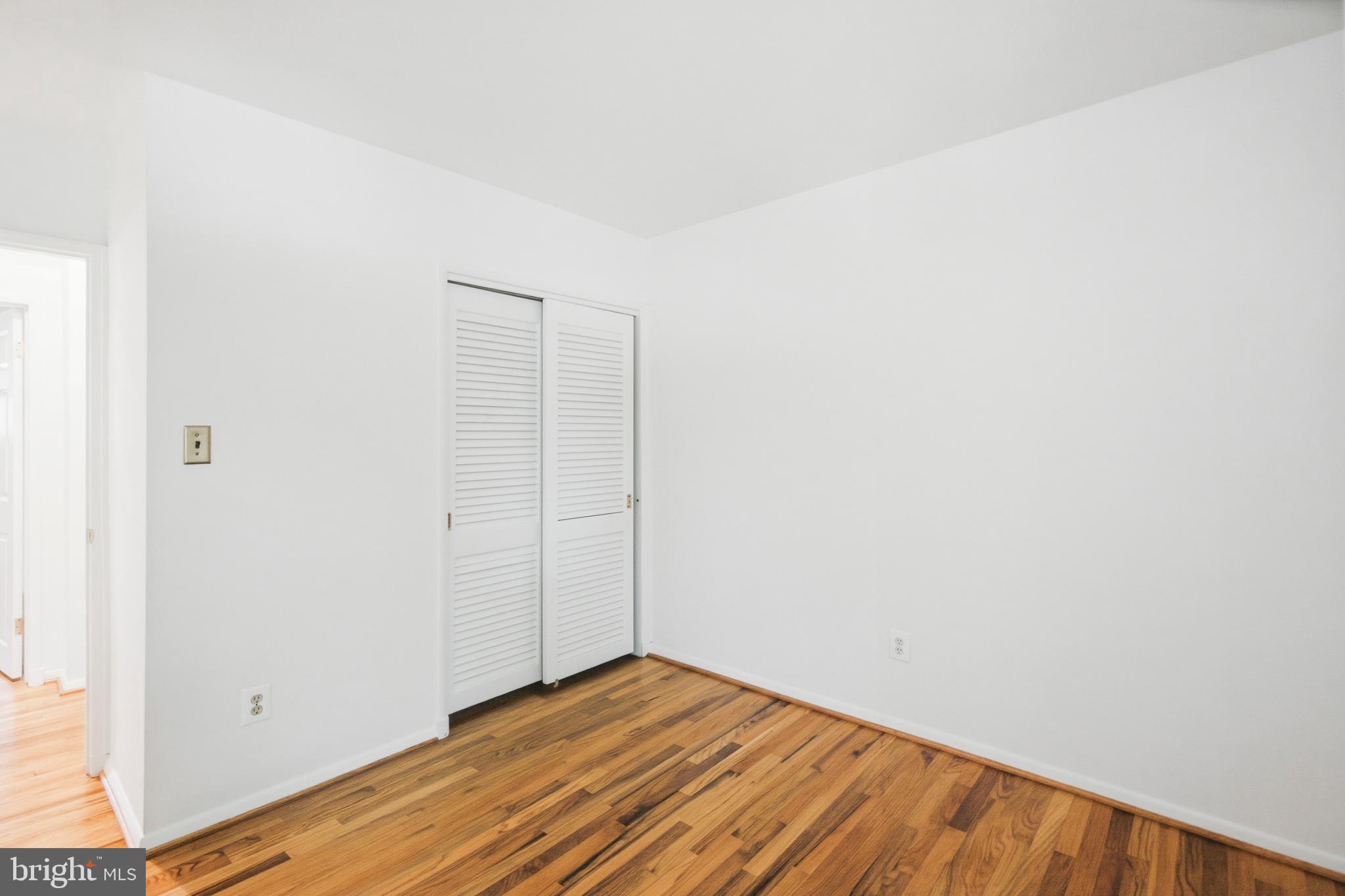 220 Solway Road Lutherville-Timonium, MD 21093 - Photo 17 of 38 a view of empty room with wooden floor