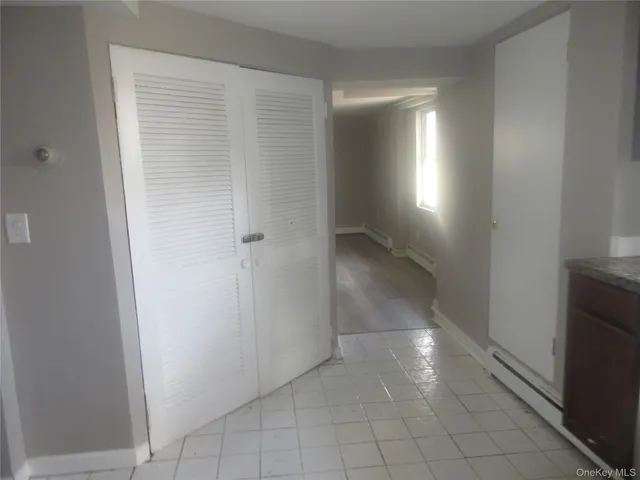 a view of an empty room and a window