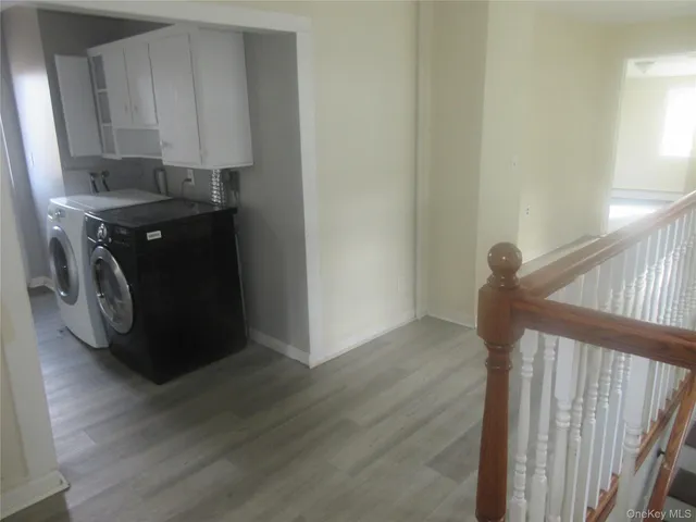 a view of a brick house with a wooden floor