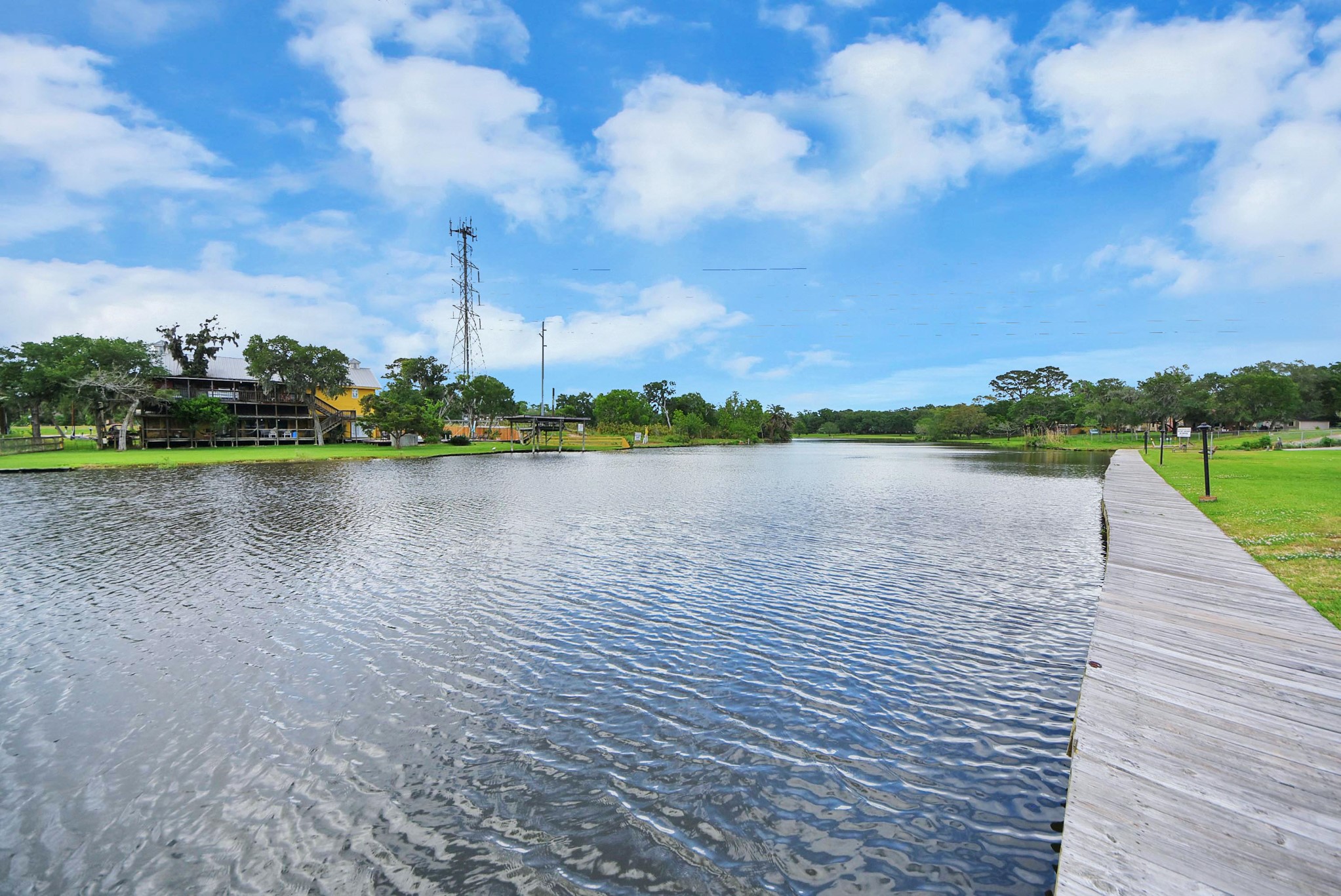 2117 Casa Rio Circle Dickinson, TX 77539 - Photo 4 of 23 a view of a lake with houses in the back