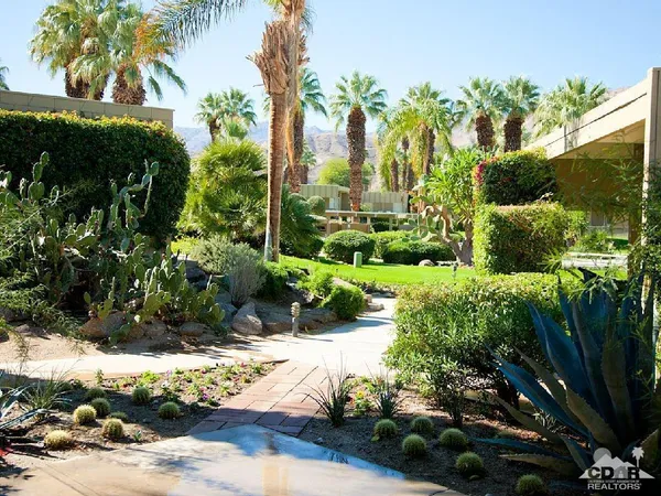 a view of a garden with a fountain