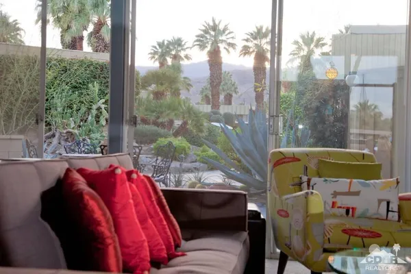 a view of balcony with furniture