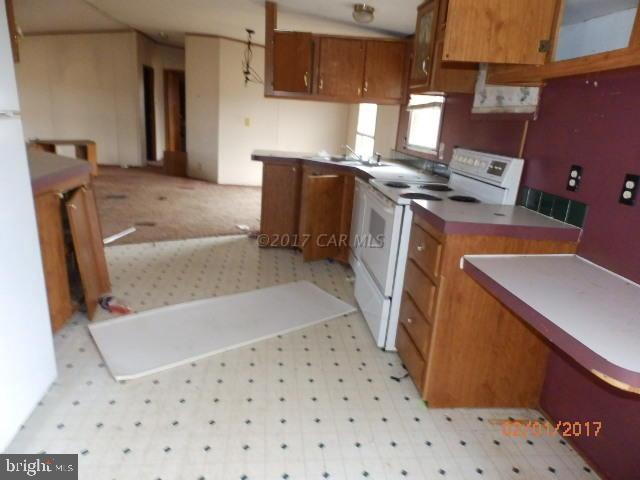 26595 Siloam Road Salisbury, MD 21801 - Photo 2 of 8 a view of kitchen with a sink a microwave and cabinets