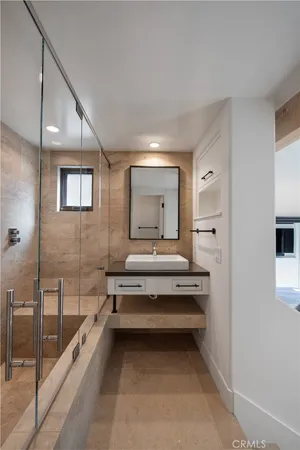 a large white bed in a white room