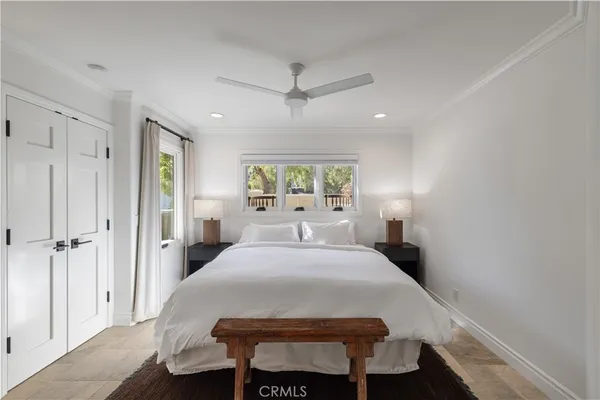 a bedroom with a bed and window